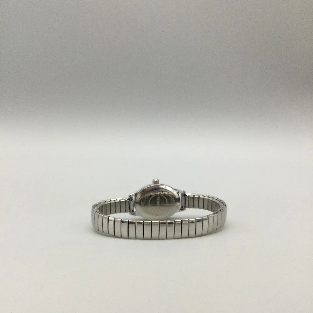 TKIIOER Womens Watch 19mm Silver Tone White Oval Dial Stretch Band New Battery